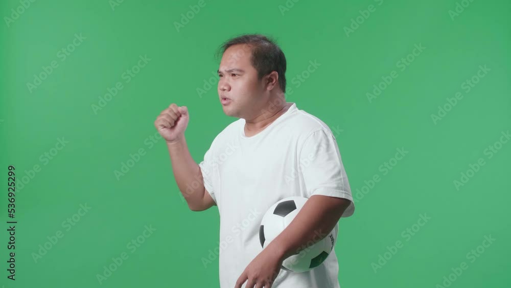 Side View Of Asian Man With A Ball Is Rooting For Shooting At Goal And Regretting While Cheering Soccer On Green Screen Background
Side View Of Asian Man With A Ball Is Rooting For Shooting At Goal And Regretting While Cheering Soccer On Green Screen Background