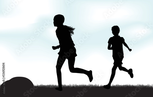 Silhouettes of children running on the grass, clouds in the background.