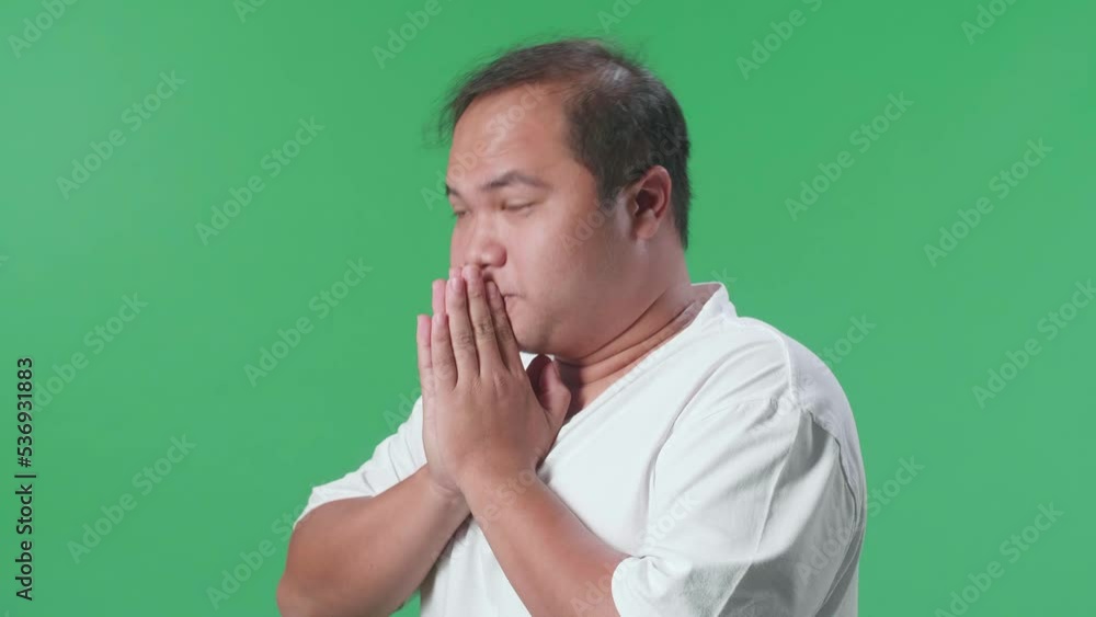 Close Up Side View Of Eyes Closed Asian Man With A Ball Pray For A Team Before Raising His Hand While Cheering Soccer On Green Screen Background
Close Up Side View Of Eyes Closed Asian Man With A Ball Pray For A Team Before Raising His Hand While Cheering Soccer On Green Screen Background