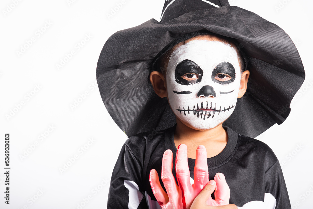 Halloween Kid. Portrait of Asian little kid boy wearing skeleton