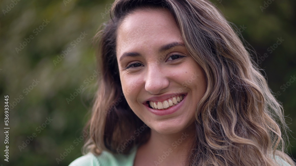 Diverse South American young woman portrait face. 20s latina girl crossing arms smiling at camera Diverse South American young woman portrait face. 20s latina girl crossing arms smiling at camera