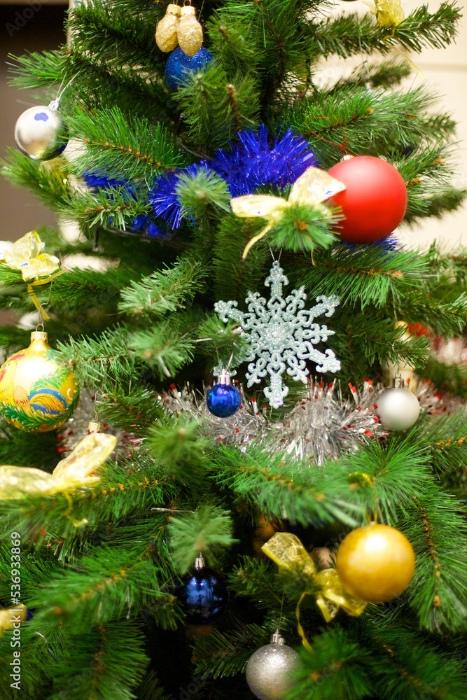 Elegant decorated with balls and figures Christmas tree