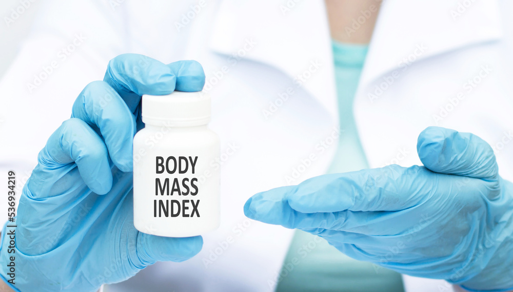 Medicine and health concept. The doctor has a box of pills in his hands, the box says - BDI Body Mass Index Medicine and health concept. The doctor has a box of pills in his hands, the box says - BDI Body Mass Index