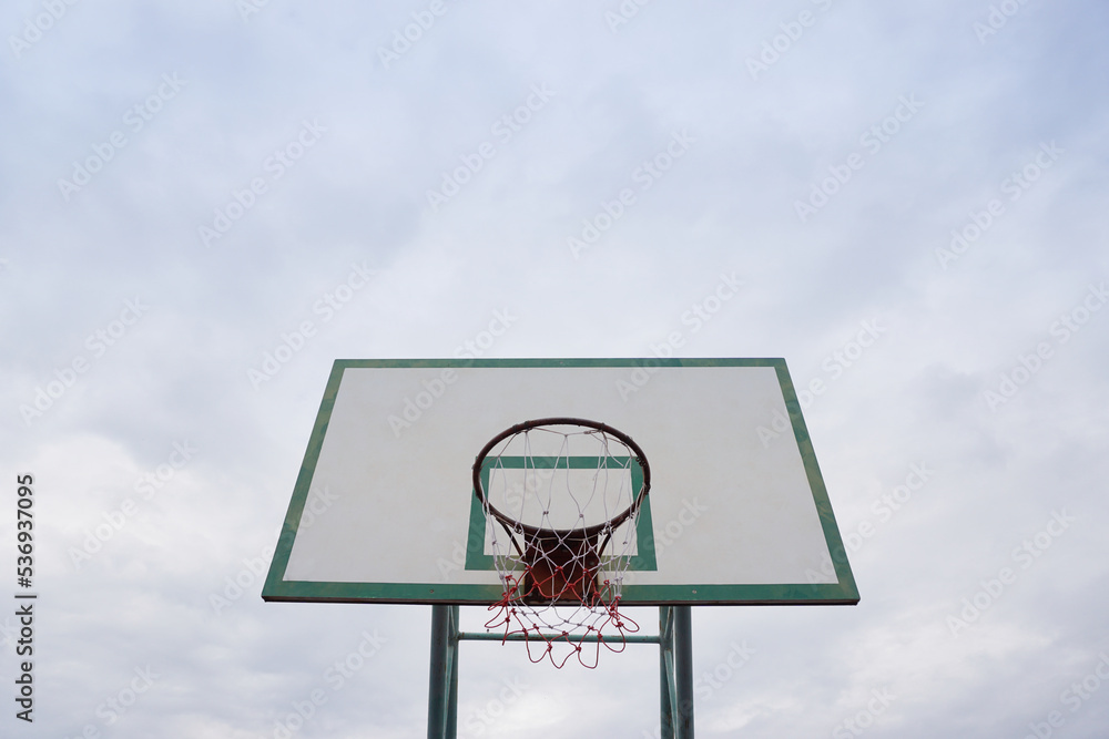 Basketball hoop with clouds sky Basketball hoop with clouds sky