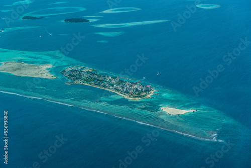 aerial view of Maafushi Island, part of South Malé Atoll with its buildings , Maafushi Jail, Mantafushi Island and Vahmaafuhi Island 