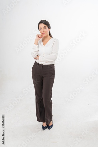 Studio portrait photo of a young beautiful elegant Brazilian female businesswoman lady wearing smart casual business attire posing with a series moments of emotion and gesture for all application