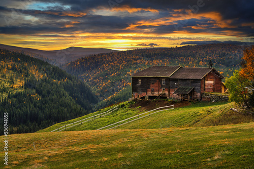 Sunset over a farmhouse barn in autumn near Rondane National Park, Norway