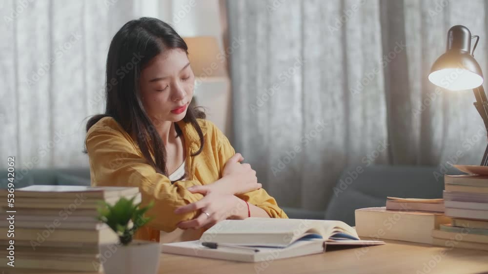 Young Asian Female Stretching After Reading The Books While Studying At Home
Young Asian Female Stretching After Reading The Books While Studying At Home