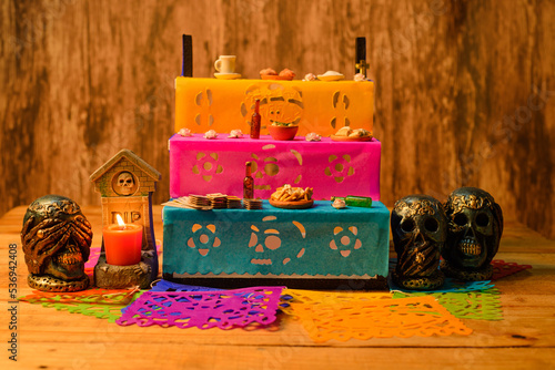 Miniature altar of the dead with offerings for deceased family members.
