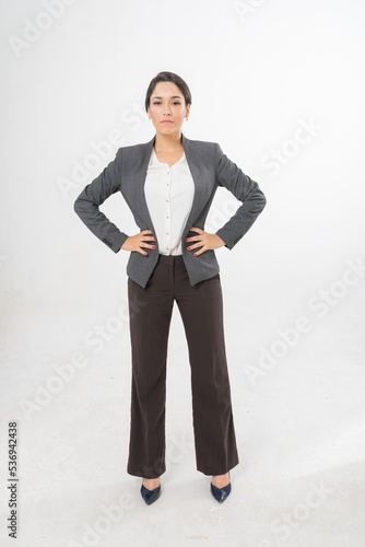 Studio portrait photo of a young beautiful elegant Brazilian female businesswoman lady wearing smart casual business attire suit posing with a series moments of emotion and gesture for all application