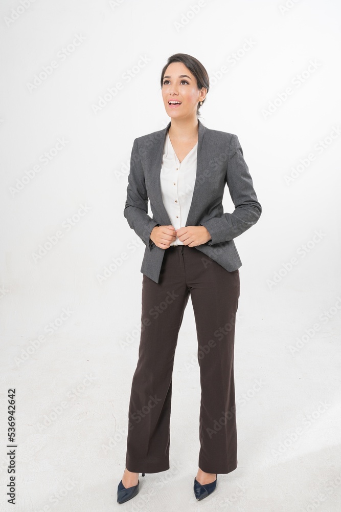 Studio portrait photo of a young beautiful elegant Brazilian female businesswoman lady wearing smart casual business attire suit posing with a series moments of emotion and gesture for all application Studio portrait photo of a young beautiful elegant Brazilian female businesswoman lady wearing smart casual business attire suit posing with a series moments of emotion and gesture for all application