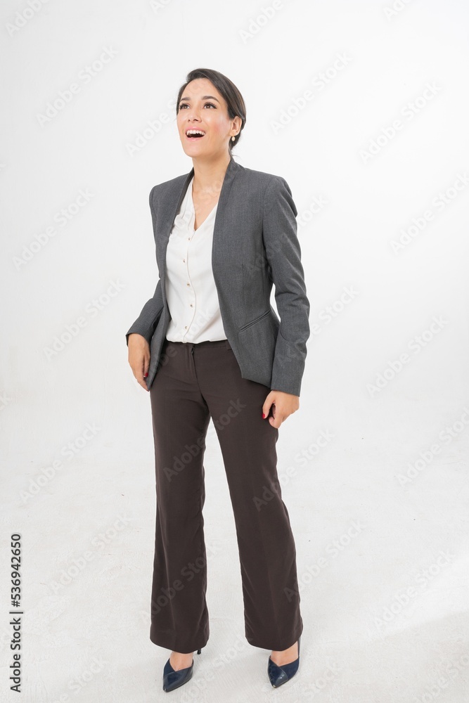 Studio portrait photo of a young beautiful elegant Brazilian female businesswoman lady wearing smart casual business attire suit posing with a series moments of emotion and gesture for all application Studio portrait photo of a young beautiful elegant Brazilian female businesswoman lady wearing smart casual business attire suit posing with a series moments of emotion and gesture for all application
