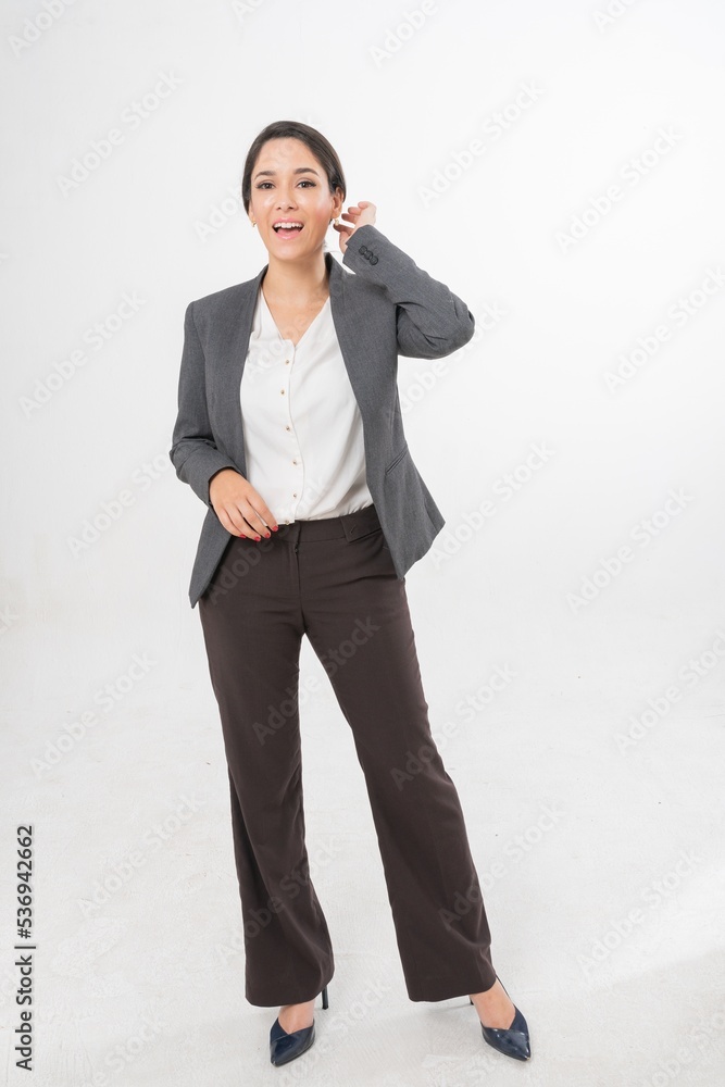 Studio portrait photo of a young beautiful elegant Brazilian female businesswoman lady wearing smart casual business attire suit posing with a series moments of emotion and gesture for all application Studio portrait photo of a young beautiful elegant Brazilian female businesswoman lady wearing smart casual business attire suit posing with a series moments of emotion and gesture for all application