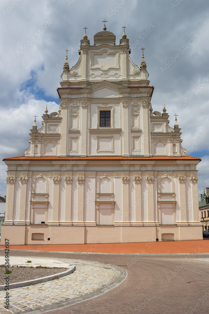 Facade of a famous church in historic city Zamosc, Poland