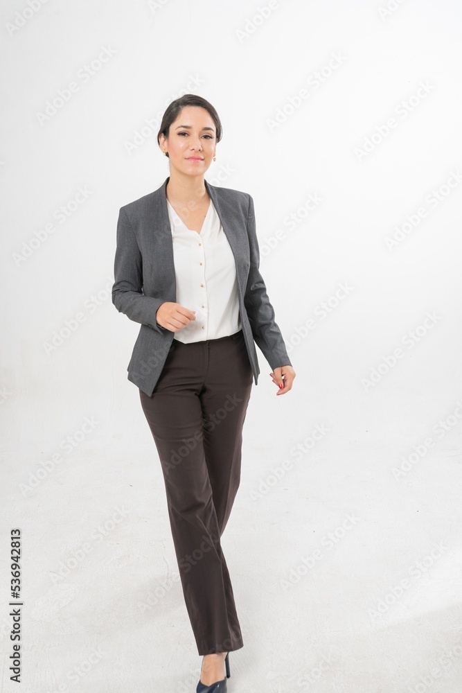 Studio portrait photo of a young beautiful elegant Brazilian female businesswoman lady wearing smart casual business attire suit posing with a series moments of emotion and gesture for all application Studio portrait photo of a young beautiful elegant Brazilian female businesswoman lady wearing smart casual business attire suit posing with a series moments of emotion and gesture for all application