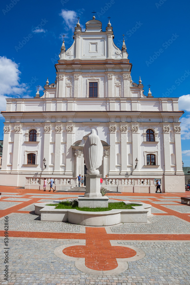 Statue in front of the historic church in Zamosc, Poland