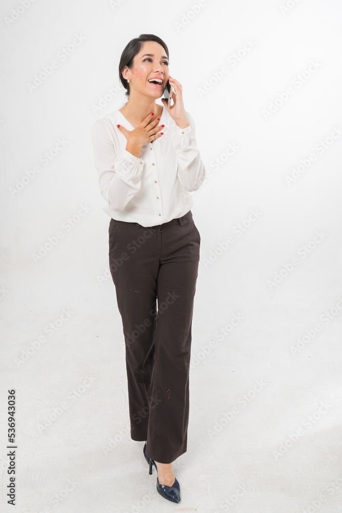 Studio portrait photo of a young beautiful elegant Brazilian female businesswoman lady wearing smart casual business attire posing with a series moments of emotion and gesture of using her smartphone Studio portrait photo of a young beautiful elegant Brazilian female businesswoman lady wearing smart casual business attire posing with a series moments of emotion and gesture of using her smartphone