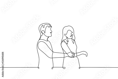 man grabbed a woman by the elbow she wants to avoid it - one line drawing vector. concept sticky interlocutor, harassment, abuse