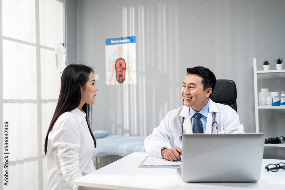 Asian woman patient visit and consult health problem with young doctor. Asian woman patient visit and consult health problem with young doctor.