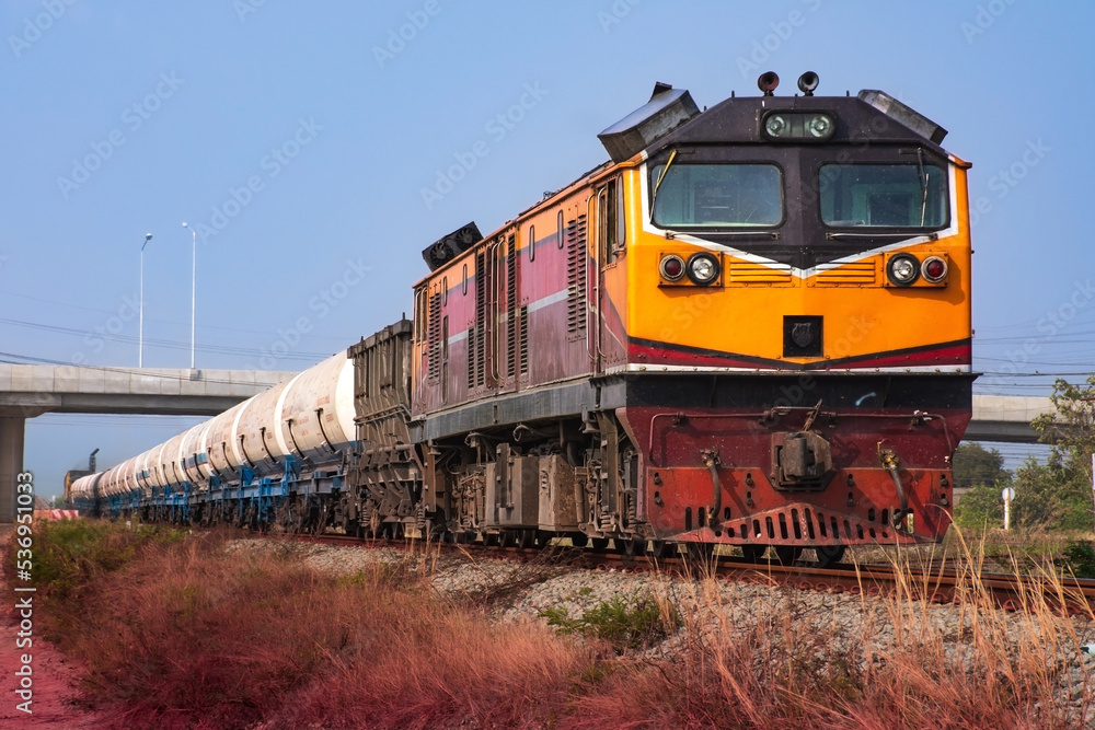 Tanker-freight train by diesel locomotive on the railway. Tanker-freight train by diesel locomotive on the railway.