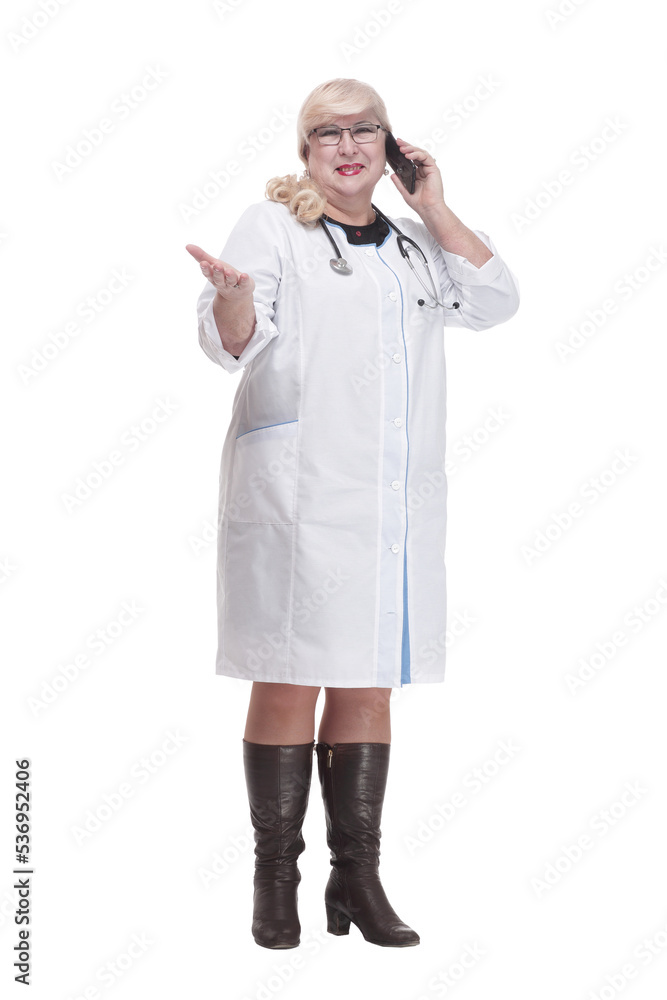 in full growth. attending doctor using her smartphone. in full growth. attending doctor using her smartphone.