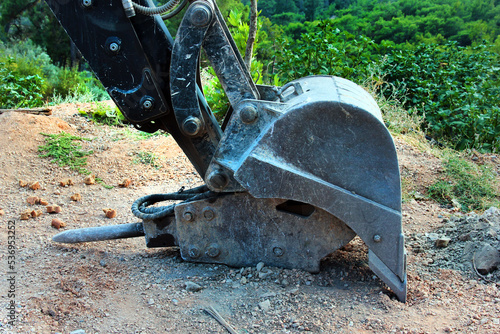 Old excavator bucket with hammer