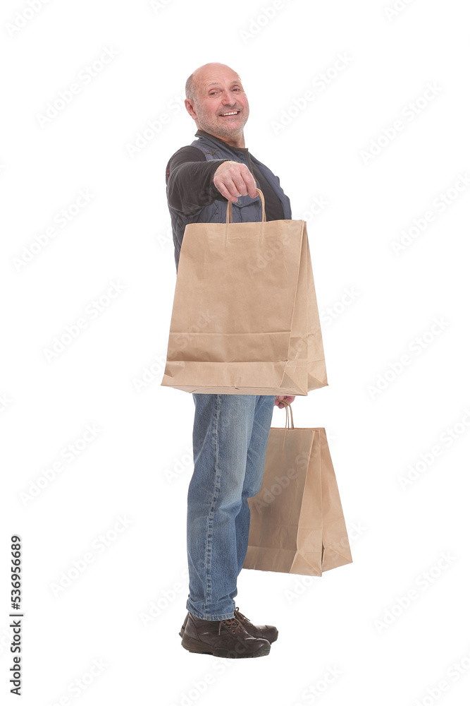 Side view of happy matured man carrying shopping bags Side view of happy matured man carrying shopping bags