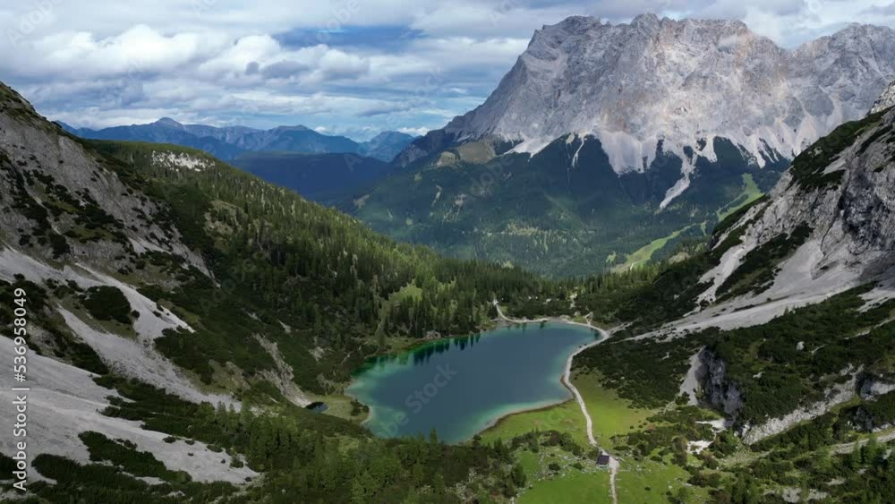 Aerial view Alps mountain range in Germany with forest and lake Aerial view Alps mountain range in Germany with forest and lake