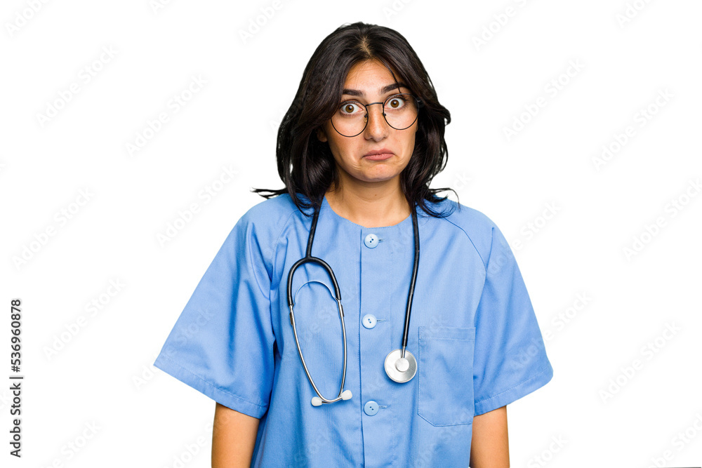 Young nurse Indian woman isolated shrugs shoulders and open eyes confused. Young nurse Indian woman isolated shrugs shoulders and open eyes confused.