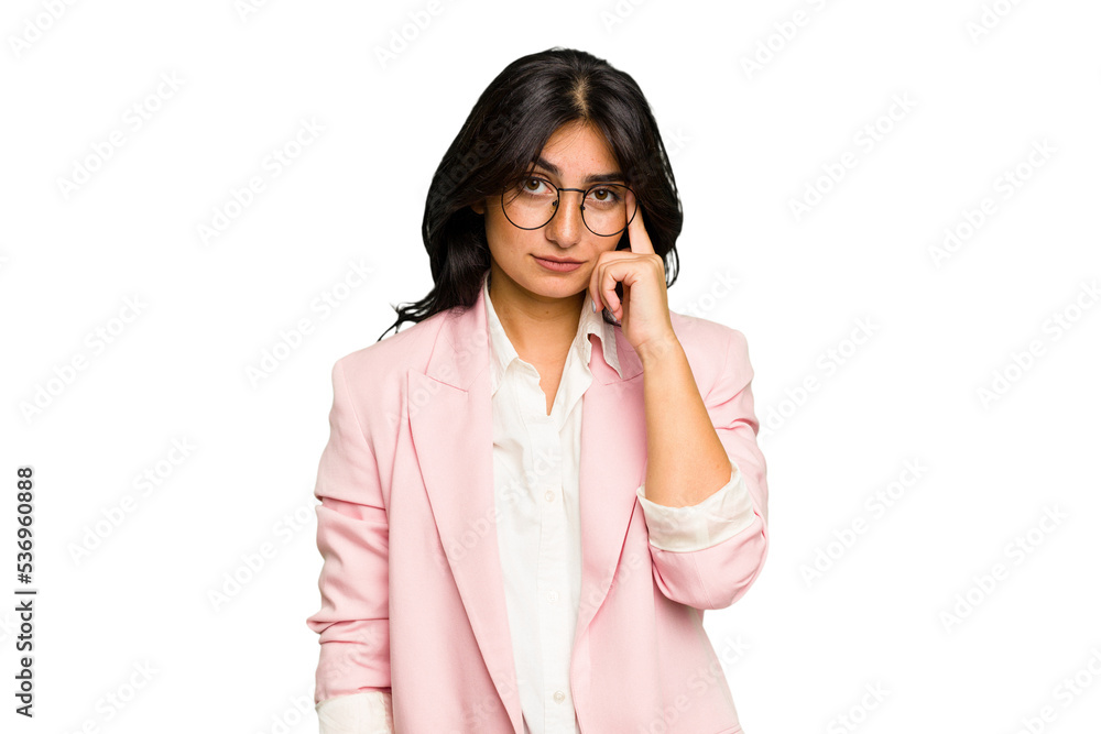 Young Indian business woman wearing a pink suit isolated pointing temple with finger, thinking, focused on a task. Young Indian business woman wearing a pink suit isolated pointing temple with finger, thinking, focused on a task.