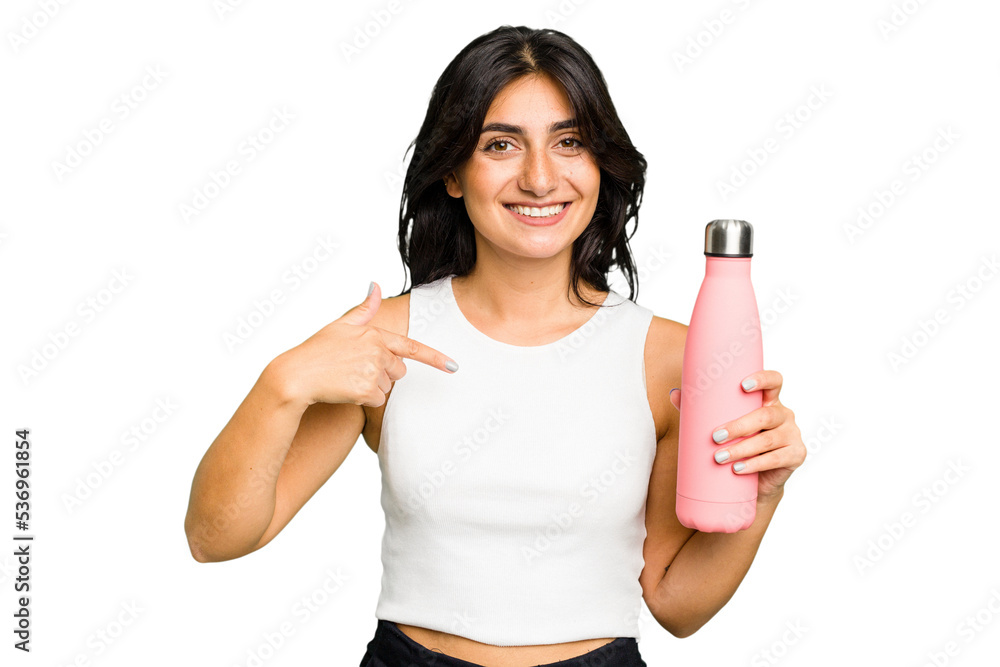 Young Indian woman holding a thermo isolated person pointing by hand to a shirt copy space, proud and confident Young Indian woman holding a thermo isolated person pointing by hand to a shirt copy space, proud and confident