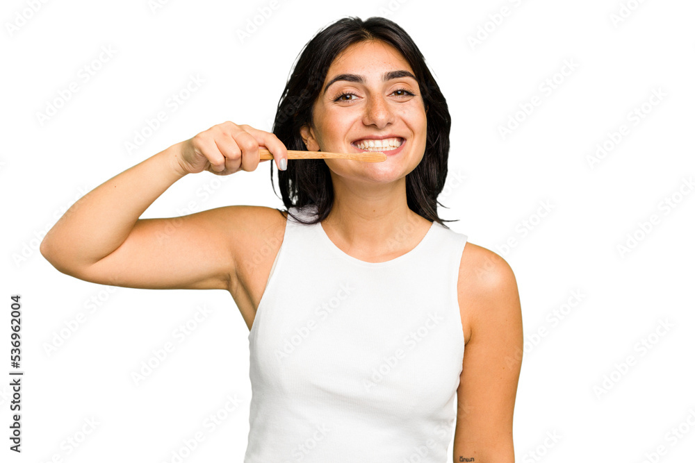 Young Indian woman holding a toothbrush isolated Young Indian woman holding a toothbrush isolated