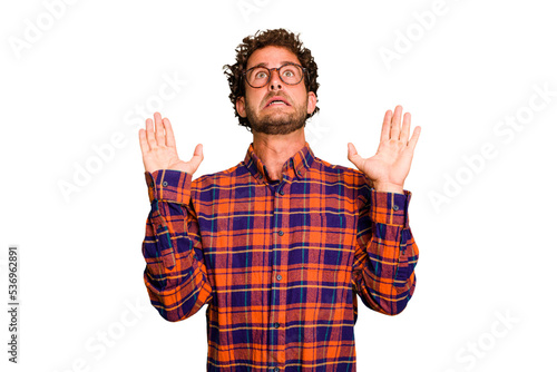 Young caucasian curly hair man isolated Young caucasian man with curly hair isolated screaming to the sky, looking up, frustrated.