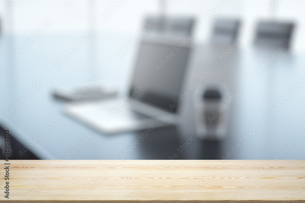 Empty wooden office table with light sunny workplace with computer on background, mock up Empty wooden office table with light sunny workplace with computer on background, mock up