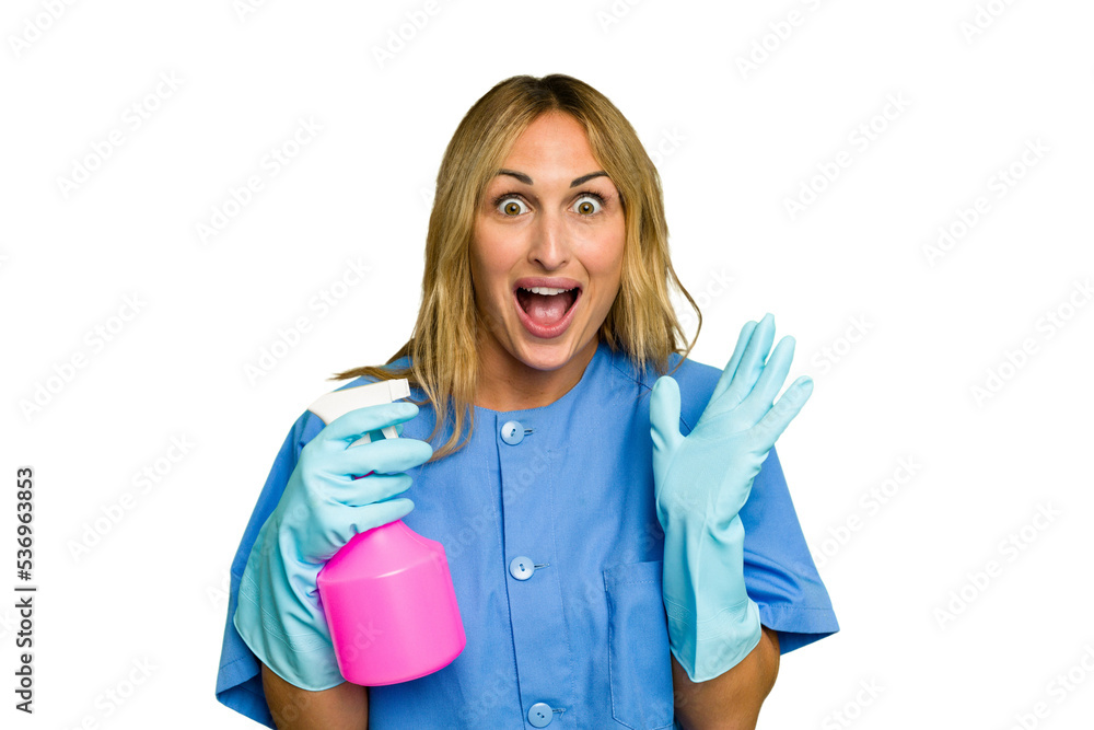 Young cleaner caucasian woman isolated green chroma background surprised and shocked. Young cleaner caucasian woman isolated green chroma background surprised and shocked.