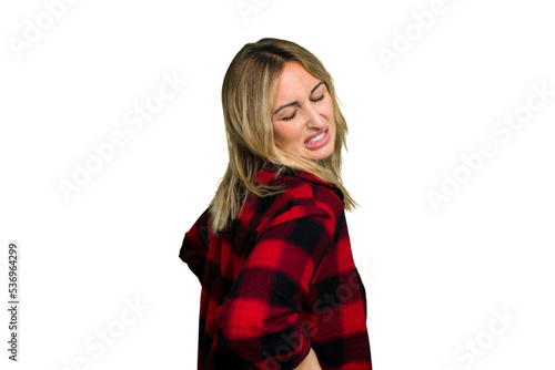 Young caucasian woman isolated on green chroma background suffering a back pain.