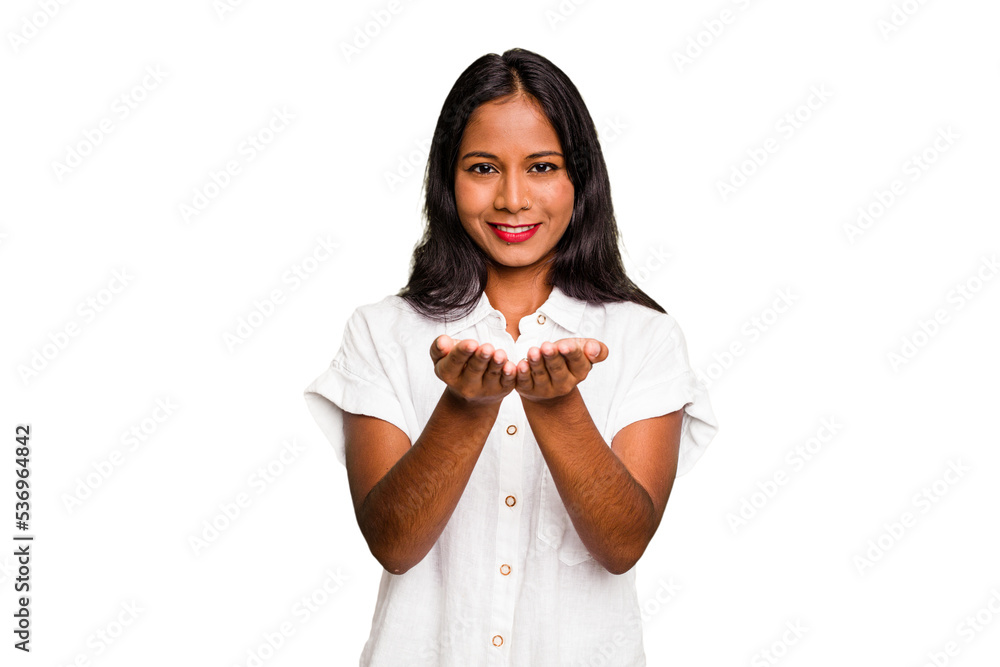 Young Indian woman isolated holding something with palms, offering to camera. Young Indian woman isolated holding something with palms, offering to camera.