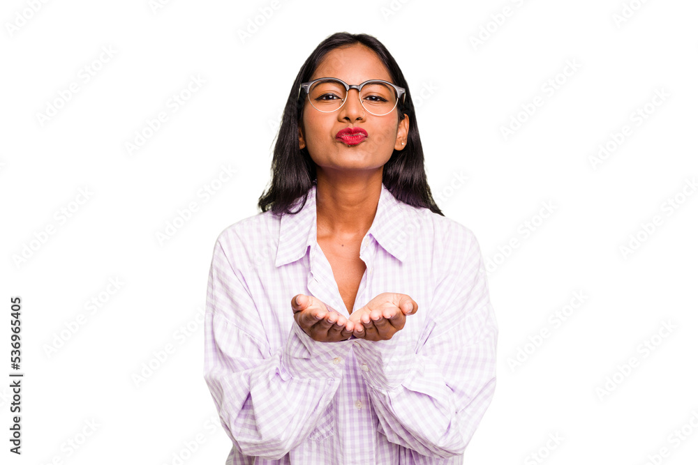 Young Indian woman isolated folding lips and holding palms to send air kiss. Young Indian woman isolated folding lips and holding palms to send air kiss.