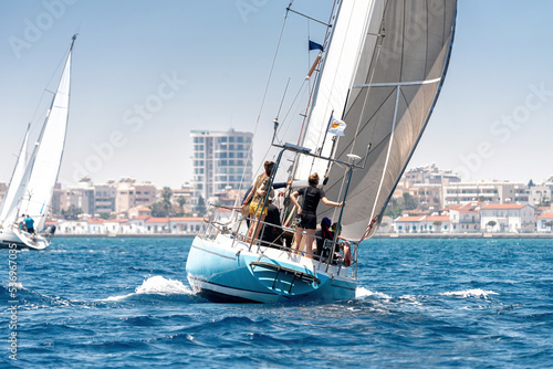 Sailing crew on sailboat during regatta at Larnaca bay