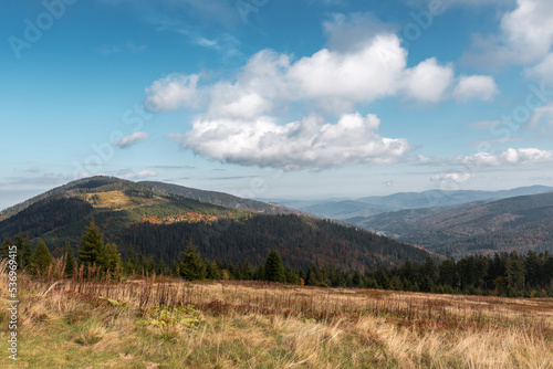 Beautiful autumn mountain landscape. Autumn colors. A view of the "Romanka" mountain massif and a beautiful mountain valley. Rysianka, Poland