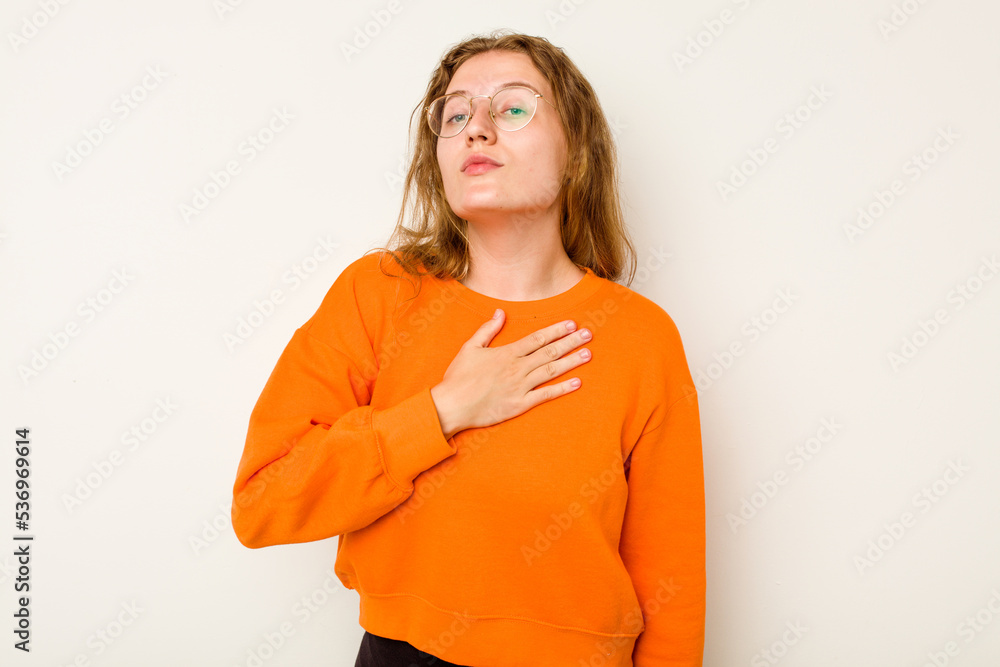 Young caucasian woman isolated on white background taking an oath, putting hand on chest. Young caucasian woman isolated on white background taking an oath, putting hand on chest.