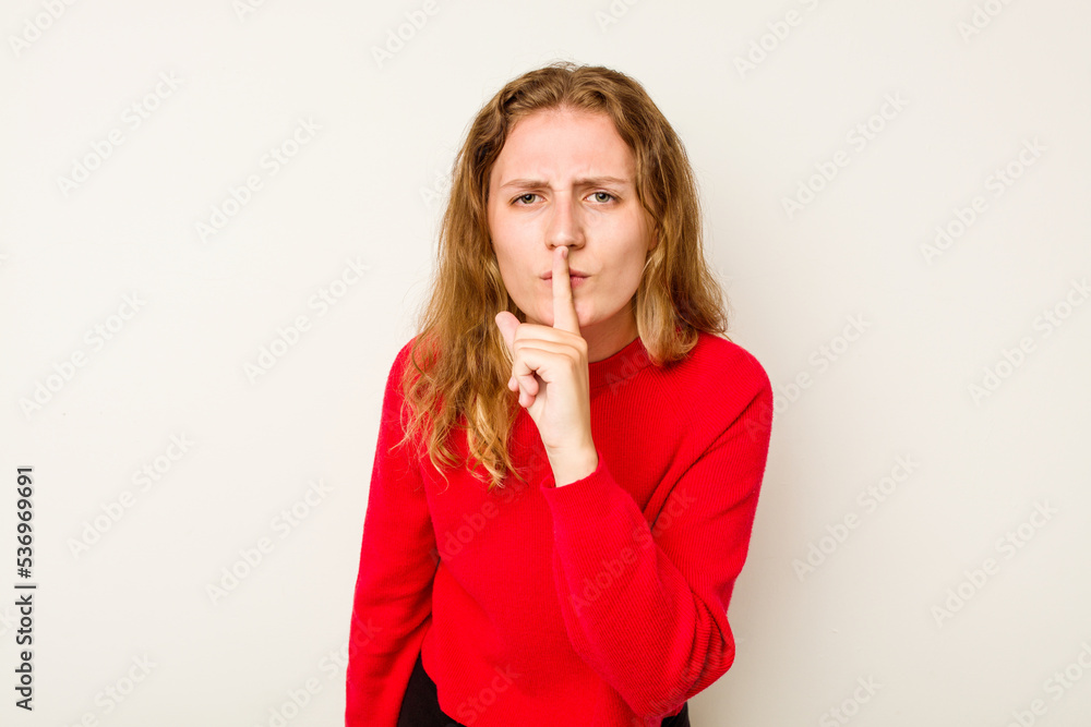 Young caucasian woman isolated on white background keeping a secret or asking for silence. Young caucasian woman isolated on white background keeping a secret or asking for silence.