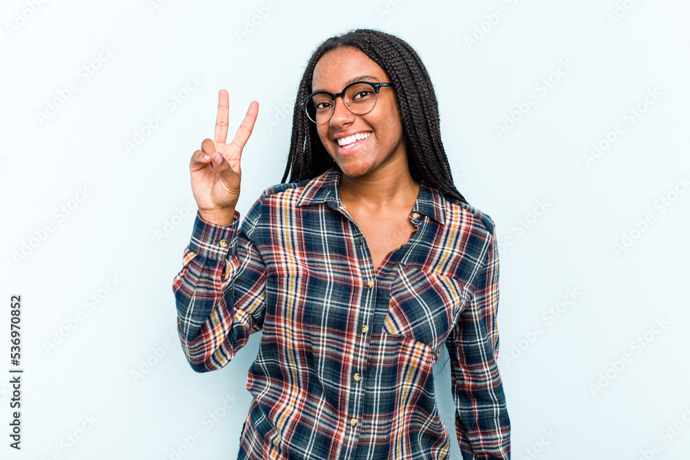 Young African American woman with braids hair isolated on blue background showing number two with fingers. Young African American woman with braids hair isolated on blue background showing number two with fingers.
