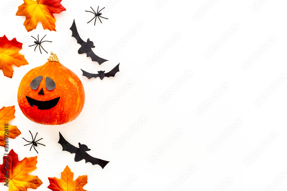 Festive Halloween decoration with pumpkin head and black bats Festive Halloween decoration with pumpkin head and black bats