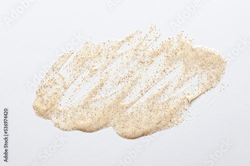 Sample cream scrub for washing with vitamin F. An exfoliating skin care product. White background photo