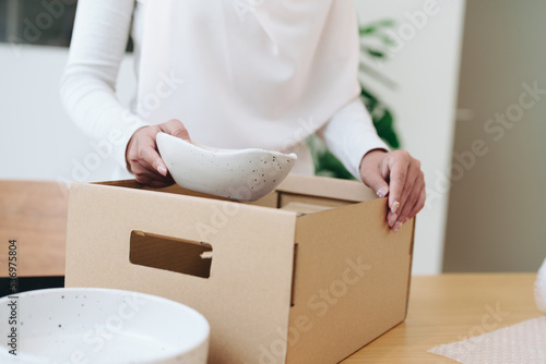 Beautiful Muslim woman selling online at home, business owner, business sme concepts