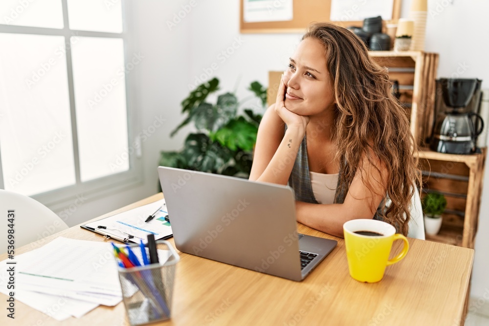 Fototapeta premium Young beautiful hispanic woman business worker using laptop working at office