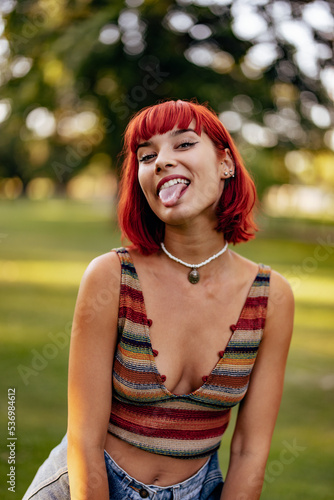 Portrait of a cute girl  posing for the camera  sticking her tongue out.