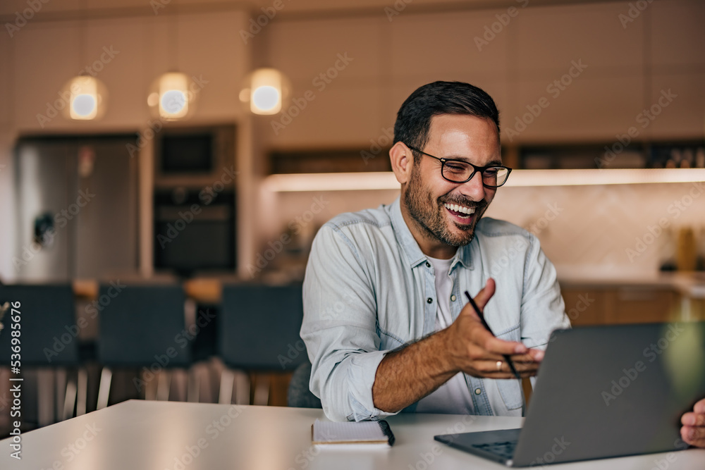 Businessmen having an online meeting, explaining something while smiling. Businessmen having an online meeting, explaining something while smiling.