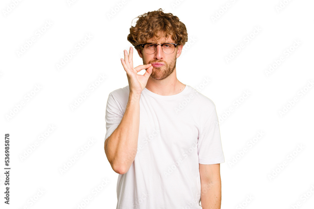 Young caucasian man isolated on green chroma background with fingers on lips keeping a secret. Young caucasian man isolated on green chroma background with fingers on lips keeping a secret.
